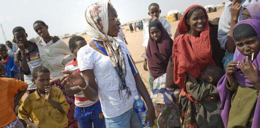 LWF worker Leah Odongo speaks with women in Dadaab refugee camp. Photo: LWF/Jonathan Ernst