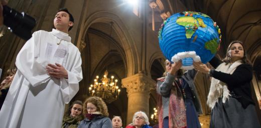 Youth hold symbols of creation during an ecumenical celebration at the Cathredral of Notre Dame de Paris during the COP 21 climate talks taking place in nearby Le Bourget, 3 December 2015 Photo: LWF/Ryan Rodrick Beiler