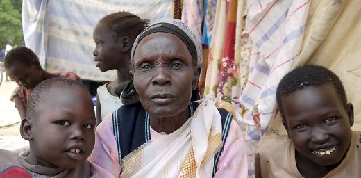 Tabisa Nyabol and her grandchildren in Adjumani, Uganda. Photo: ACT-DCA-LWF/Mai Gad
