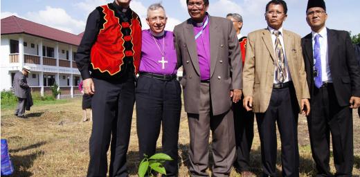 (From left) LWF General Secretary Martin Junge, LWF President Bishop Dr Munib Younan, LWF National Committee in Indonesia Chairperson Bishop Langsung Sitorus and other member church representatives with a Luther Garden partner tree planted at the Ecumenical Center of the Council of Protestant Indonesian Churches in North Sumatra on 15 June 2014. Photo: LWF/C. KÃ¤stner
