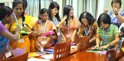 Women delegates from LWF member churches in Asia make paper windmills at the Women in Church and Society meeting, held before the regional Pre-Assembly. Photo: LWF/A. Danielsson