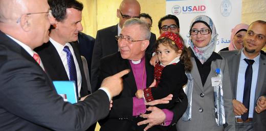 The ribbon cutting ceremony, led by Bishop Munib A. Younan, holding a child who may be undergoing a bone marrow transplantation in the newly opened Bone Marrow Transplant Unit. Photo: LWF Jerusalem