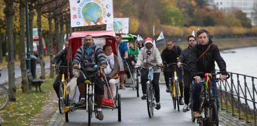 The statement was delivered by faith leaders on bicycles, promoting sustainable lifestyles. Photo: WCC/Sean Hawkey.