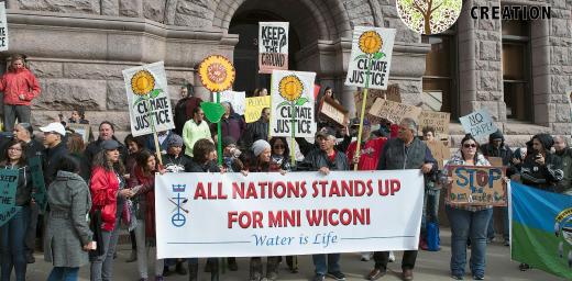 About 200 people gathered outside Minneapolis City Hall in October 2016 to protest the Dakota Access Pipeline which will pass upstream from the Standing Rock Sioux Nation. Along with the threat to their water supply, the tribe claims the pipeline will destroy burial sites and sacred places. Photo: Fibonacci Blue (CC BY 2.0)