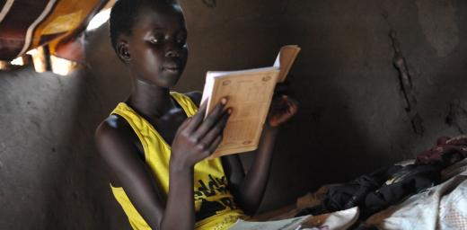 A young girl, refugee from South Sudan, studies in Adjumani, Northern Uganda. Lack of sanitation threatens the improving school enrolment for girls. Photo: LWF/ M. Renaux