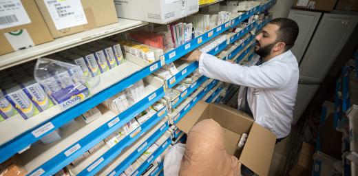 Dr Farmacist Nicolas Saliba restocks medicine at Augusta Victoria Hospital, Jerusalem. Photo: LWF/Albin Hillert