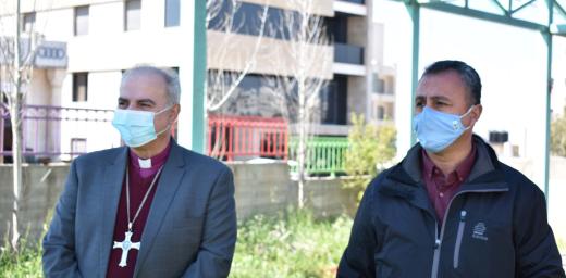 Bishop Azar and EEC Executive Director Simon Awad plant trees in the 