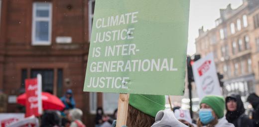 During the UN climate conference COP26, LWF delegates joined a climate march. One banner read âClimate justice is intergenerational justiceâ. Photo: LWF/Albin Hillert
