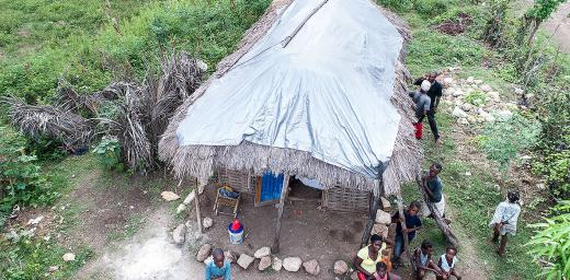 The family of Annita Mesu (24) pictured in front of her house in the village Boisrond near Aquin, 22.08.2017. After the Hurricane Matthew in September 2016, KORAL distributed the family plastic sheets and water filter. Photos: Thomas Lohnes/DKH
