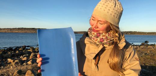 Solveig Egeland, an artist and cultural advisor to the Church of Norwayâs Diocese of Borg with a piece of plastic from the ocean. Photo: Mari Tefre