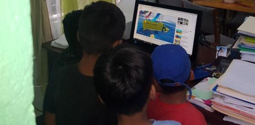 Children from Nicaragua watch a movie in the ILCO offices. Photo: ILCO