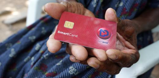 Ndapanda Mentte Shandingi shows a Nampost debit card. Photo: LWF/M. Hyden