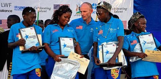 Jesse Kamstra, LWF country representative in Uganda (center), with the winners of the contest. Photos: LWF/ S. Nalubega