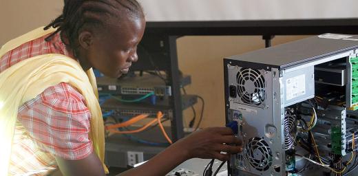 Primary school teacher Afrina Zechariah Anabak inspects the connection ports on her computer. Photo: LWF/C. KÃ¤stner