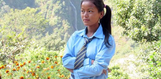 Sanu in her school uniform. The prospect of higher education prompted her to find a way of attending school, even though school is a day's walk from home. Photo: Umesh Pokharel/LWF Nepal