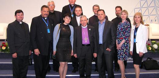 LWF President Bishop Dr Munib A. Younan with Bishop Yuri Novgorodov (very last row) and other pastors and church officials of the Evangelical Lutheran Church in the Republic of Kazakhstan, during the June visit to Astana. Photo: ELCRK