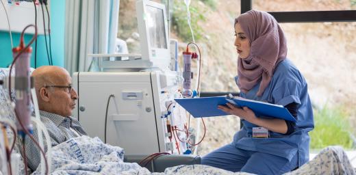 24 February 2020, Jerusalem: Nurse Hiba Almu'ti tends to Shehadi Dar-Awad, as he receives Dialysis treatment at the Augusta Victoria Hospital in Jerusalem. Photo: LWF/Albin Hillert
