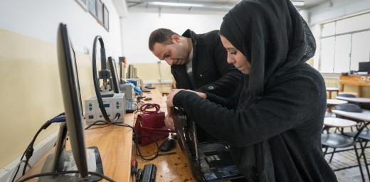 21 January 2023, Ramallah, Palestine: 19-year-old telecommunications student Reham Rajh (right) from Ramallah is at work during a class taught by Anas Shtaya (left) at the Lutheran World Federation’s Vocational Training Centre in Ramallah. The centre currently hosts 141 students across eight different training programmes. This school year, 85 of the students are female. Photo: LWF/ Albin Hillert