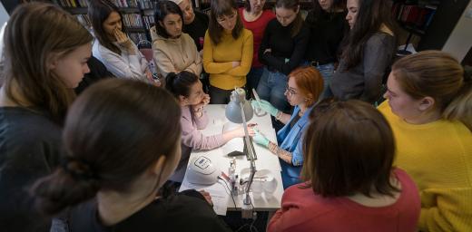 Participants witness a demonstration at the manicure workshop. Photo: LWF/ Albin Hillert