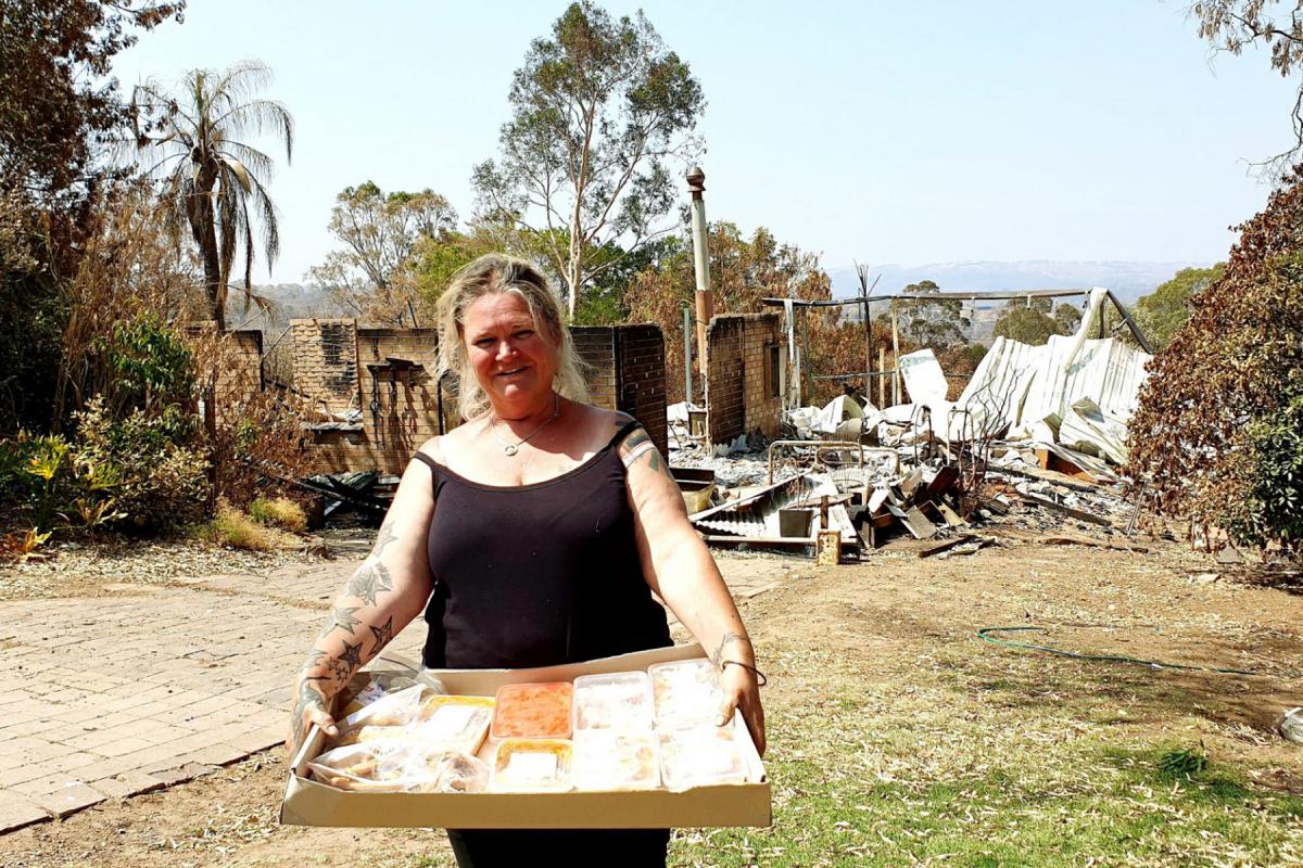 Sue Cutting, a foster mum of seven who lost her house in the fires, was delighted to receive food relief from Adelaide Hills Lutheran and community volunteers. Photos: LCA
