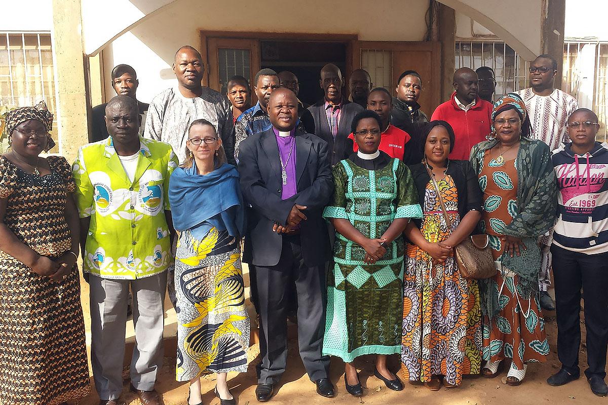 Bishop Dr Ruben Ngozo, center, LWF Area Secretary for Africa, Rev. Dr Elieshi Mungure, to his left, and LWF Vice President for Africa, Rev. Dr Jeannette Ada Epse Maina, second from right, outside the Evangelical Lutheran Church in Cameroon. Photo: LWF  