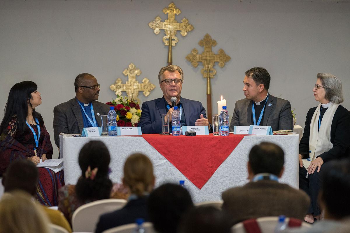 Professor Veli-Matti KaÌrkaÌinnen replies to a response panel to a paper of his. Gathered in Addis Ababa from 23-27 October 2019, Lutherans from across the globe join in consultation under the theme of 'We believe in the Holy Spirit: Global Perspectives on Lutheran Identities'. Hosted by the Ethiopian Evangelical Church Mekane Yesus, the consultation is the first phase of a study process on Lutheran identities. Photo: LWF/Albin Hillert
