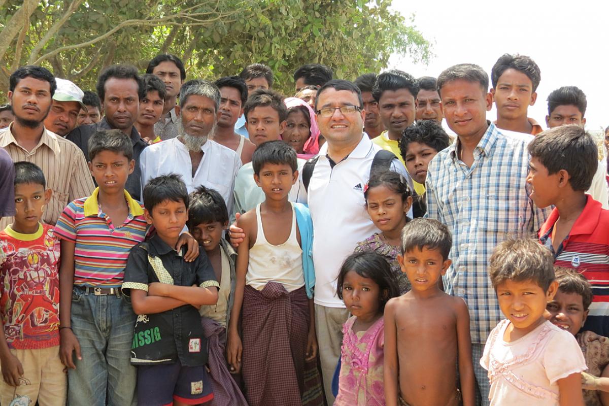Bhoj with camp management committee members and children in an IDP camp in Sittwe. Photo: LWF Myanmar