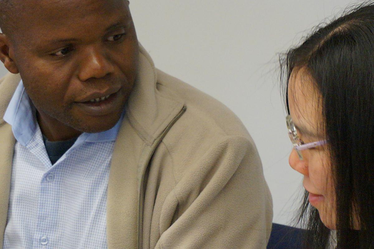 Dr Mahali in discussion with another conference participant. Photo: LWF/I. Benesch