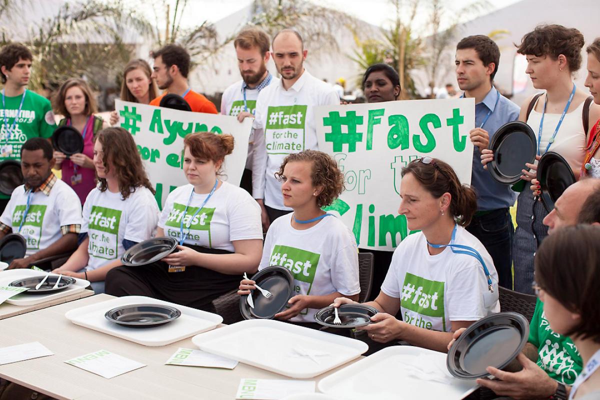 Fasting action at COP20. Photo: LWF/Sean Hawkey