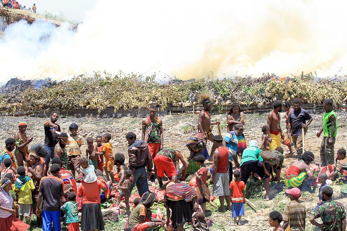 Burning the stone, originally a traditional Papuan way of cooking and also a thanksgiving ceremony, sometimes also the scene for harmful traditional practices. Photo: John Roy Purba/HKBP