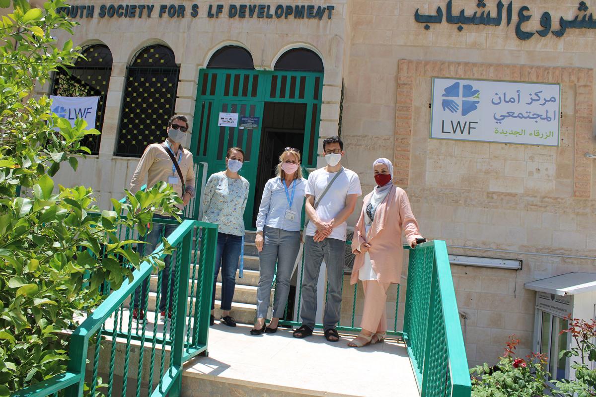 Erik Siegl from Czech Diaconia with LWF’s Caroline Tveoy and staff from the World Service team in Jordan outside the Aman community center in Zarqa. All photos: LWF/Jordan