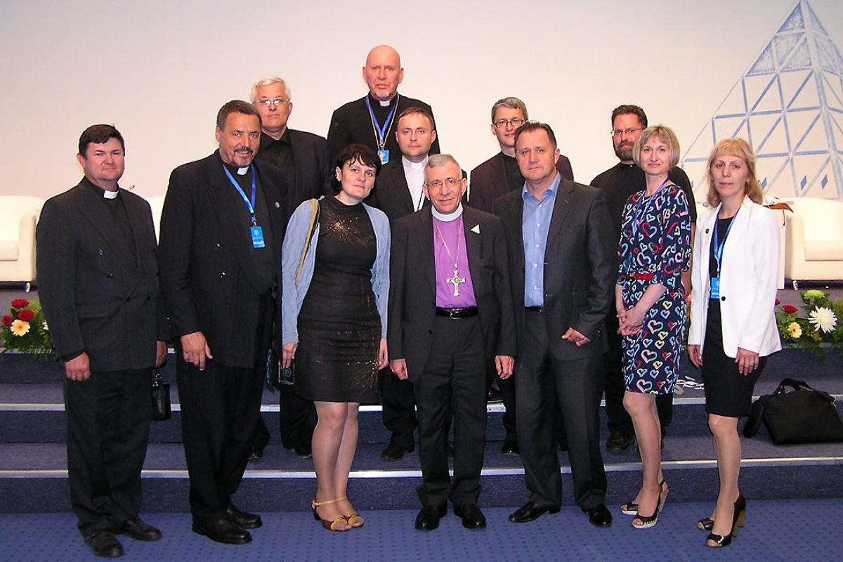 LWF President Bishop Dr Munib A. Younan with Bishop Yuri Novgorodov (very last row) and other pastors and church officials of the Evangelical Lutheran Church in the Republic of Kazakhstan, during the June visit to Astana. Photo: ELCRK